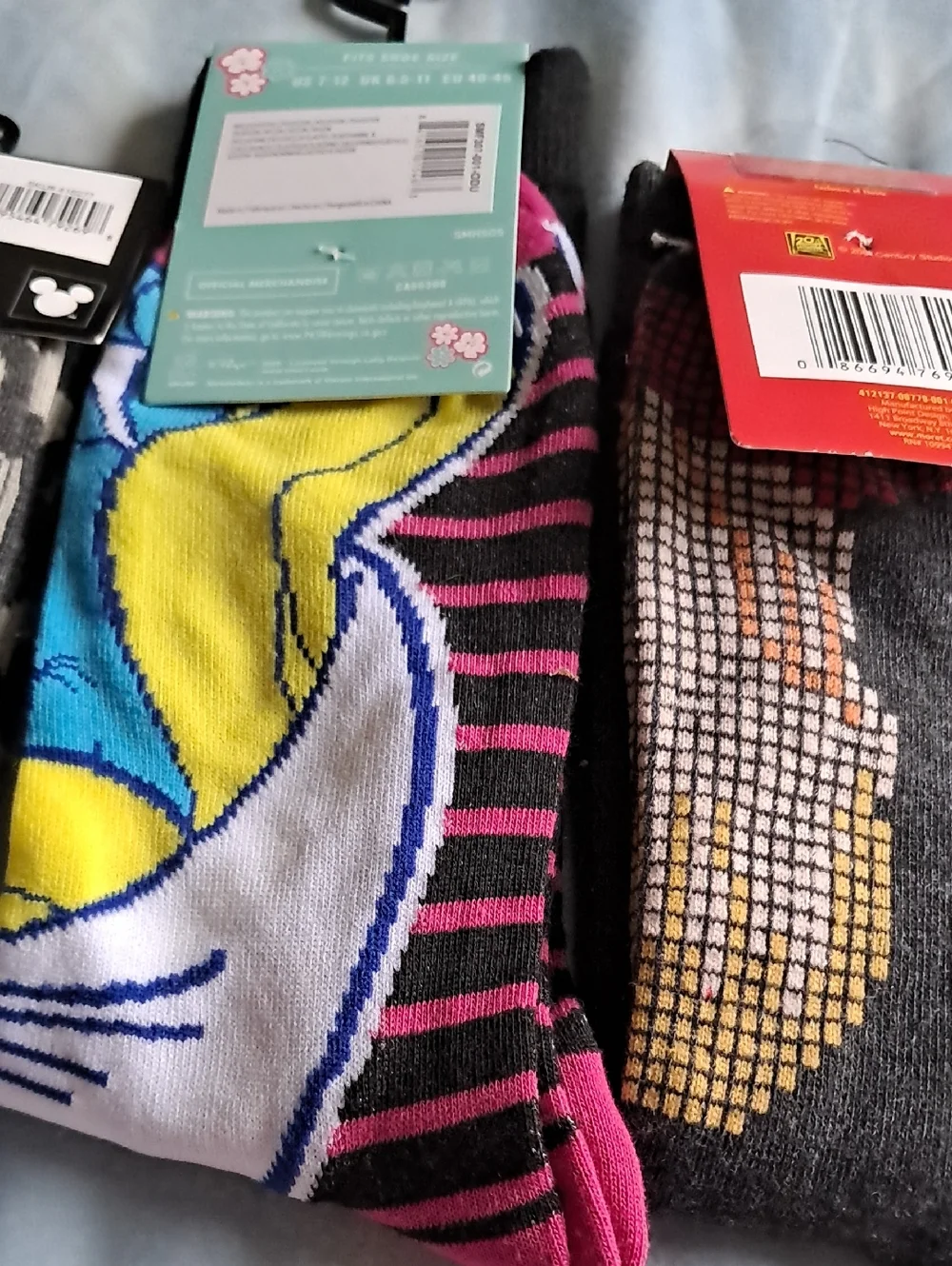 Disney, smurf and home alone socks